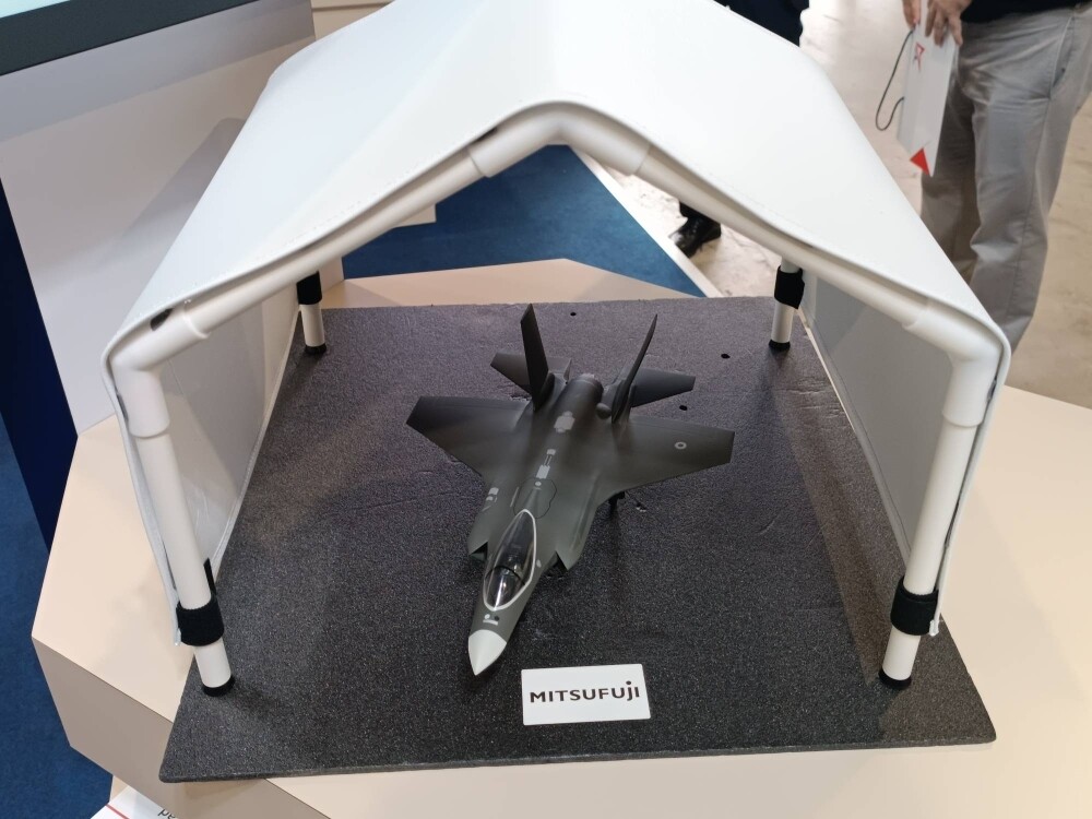 A mock-up of a hangar covered in a special material developed by Japanese firm Mitsufuji to protect aircraft and other platforms with sensitive equipment from electromagnetic threats is displayed at the Singapore Airshow on Wednesday.