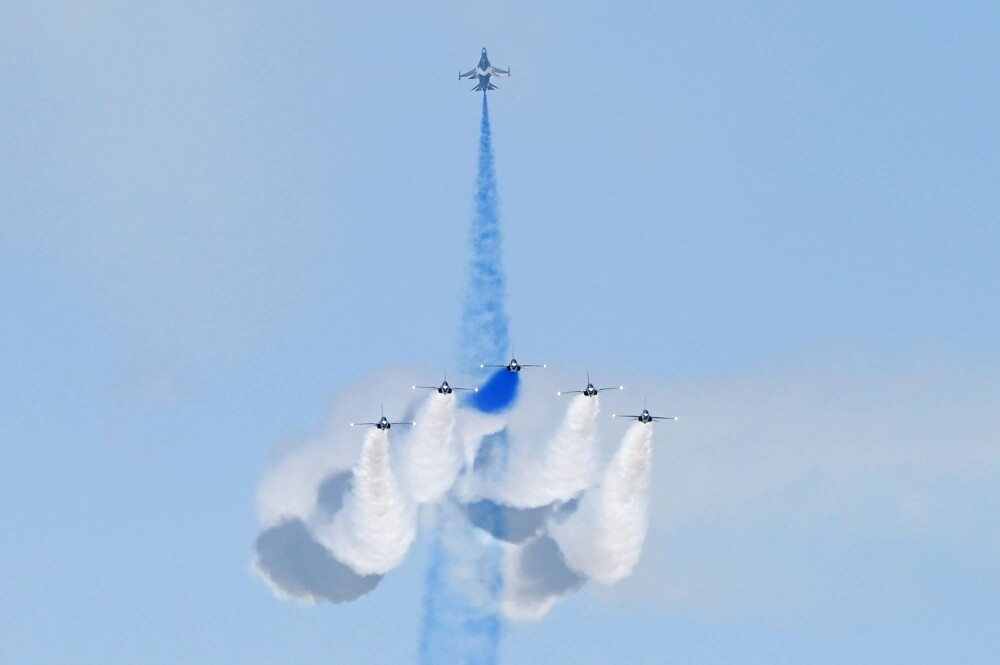 Members of the South Korean Air Force's Black Eagles aerobatics team perform an aerial display at the Singapore Airshow on Tuesday.