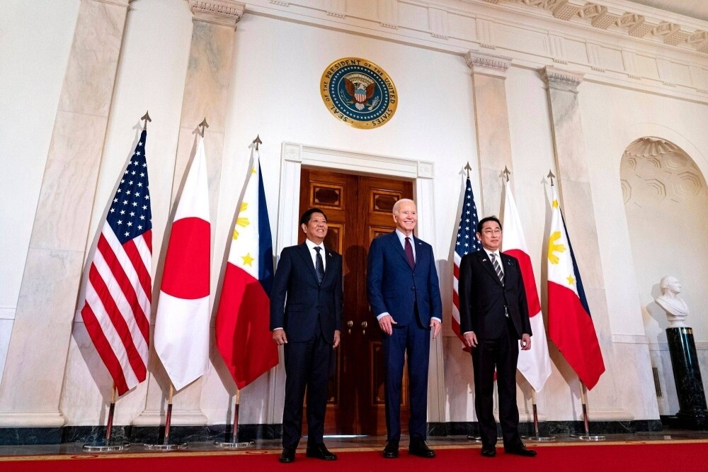 Philippine leader Ferdinand Marcos Jr., U.S. President Joe Biden and Prime Minister Fumio Kishida arrive for a trilateral meeting at the White House in Washington on April 11.
